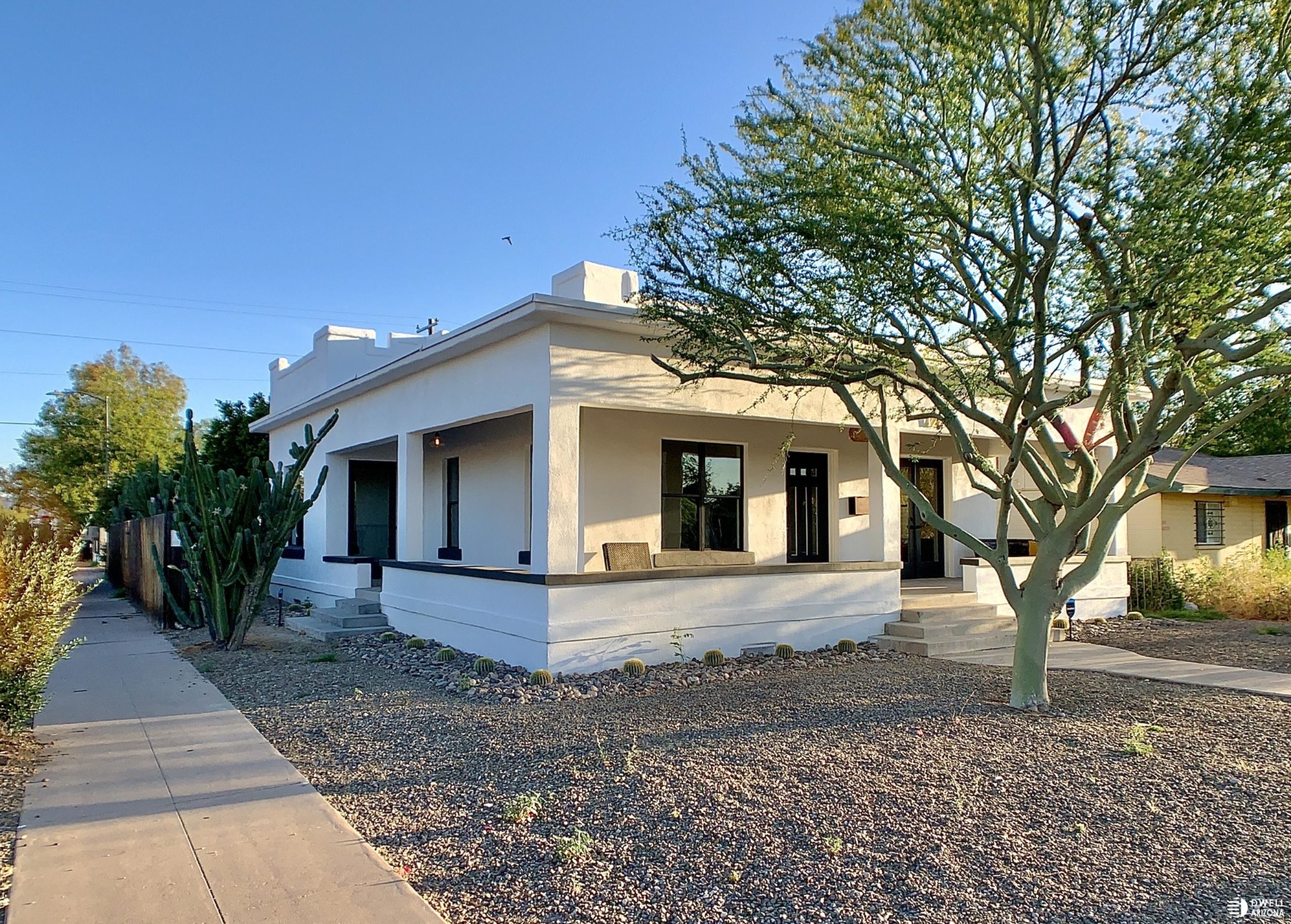 White Garfield bungalow with deep wraparound porch