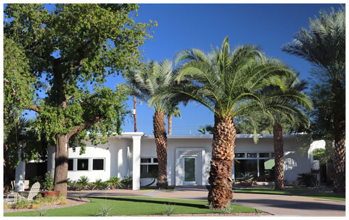 Long single-story Windsor Square residence with multiple shaded porch bays