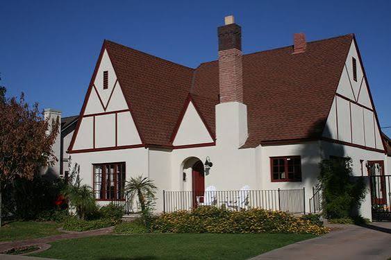 Tudor Revival inspired house with steep gables and decorative half timbering