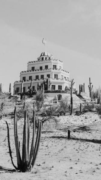 Historic black-and-white photograph of Tovrea Castle on its desert hill