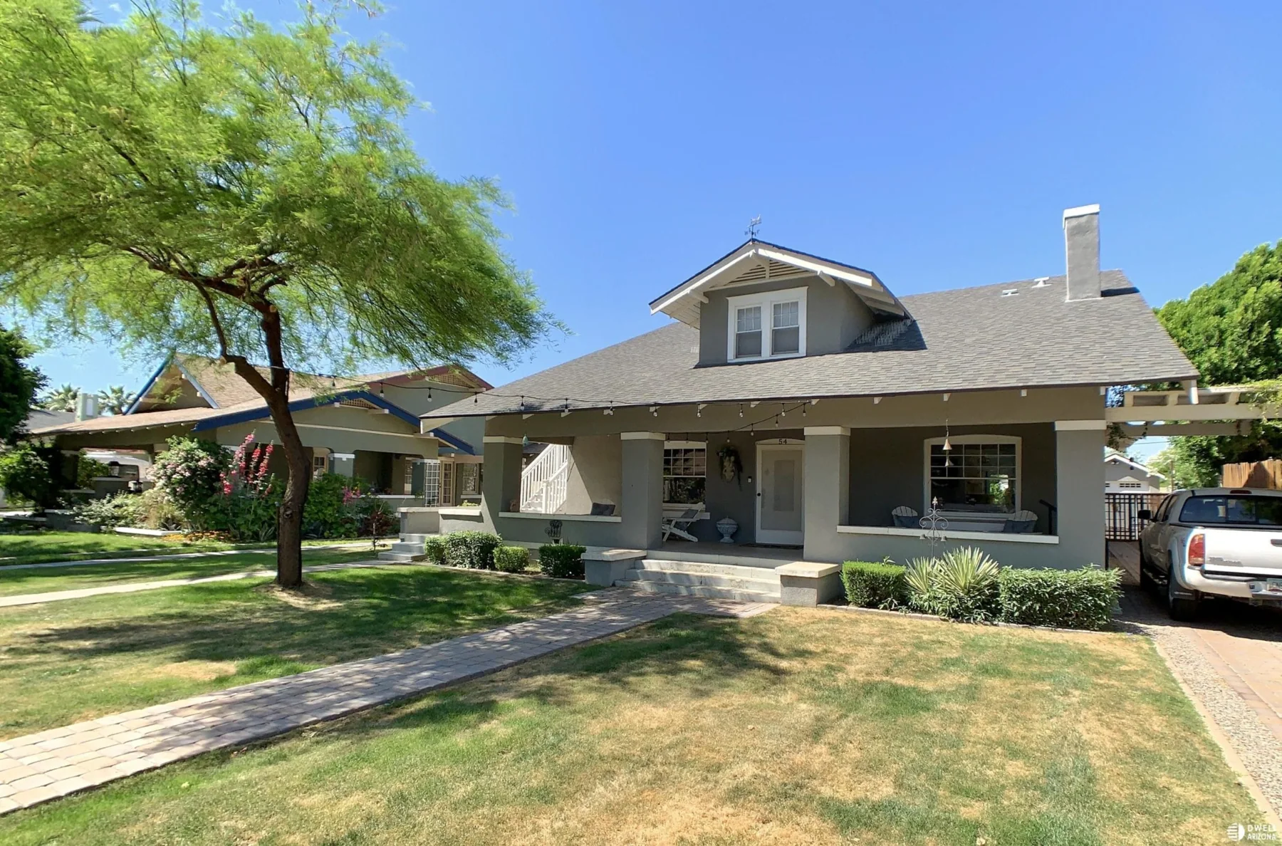 Craftsman bungalow with a broad front porch and dormer