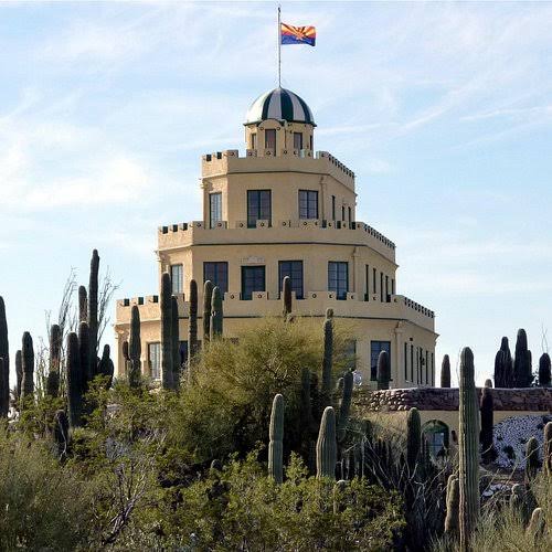 Modern color photograph of Tovrea Castle amid desert vegetation