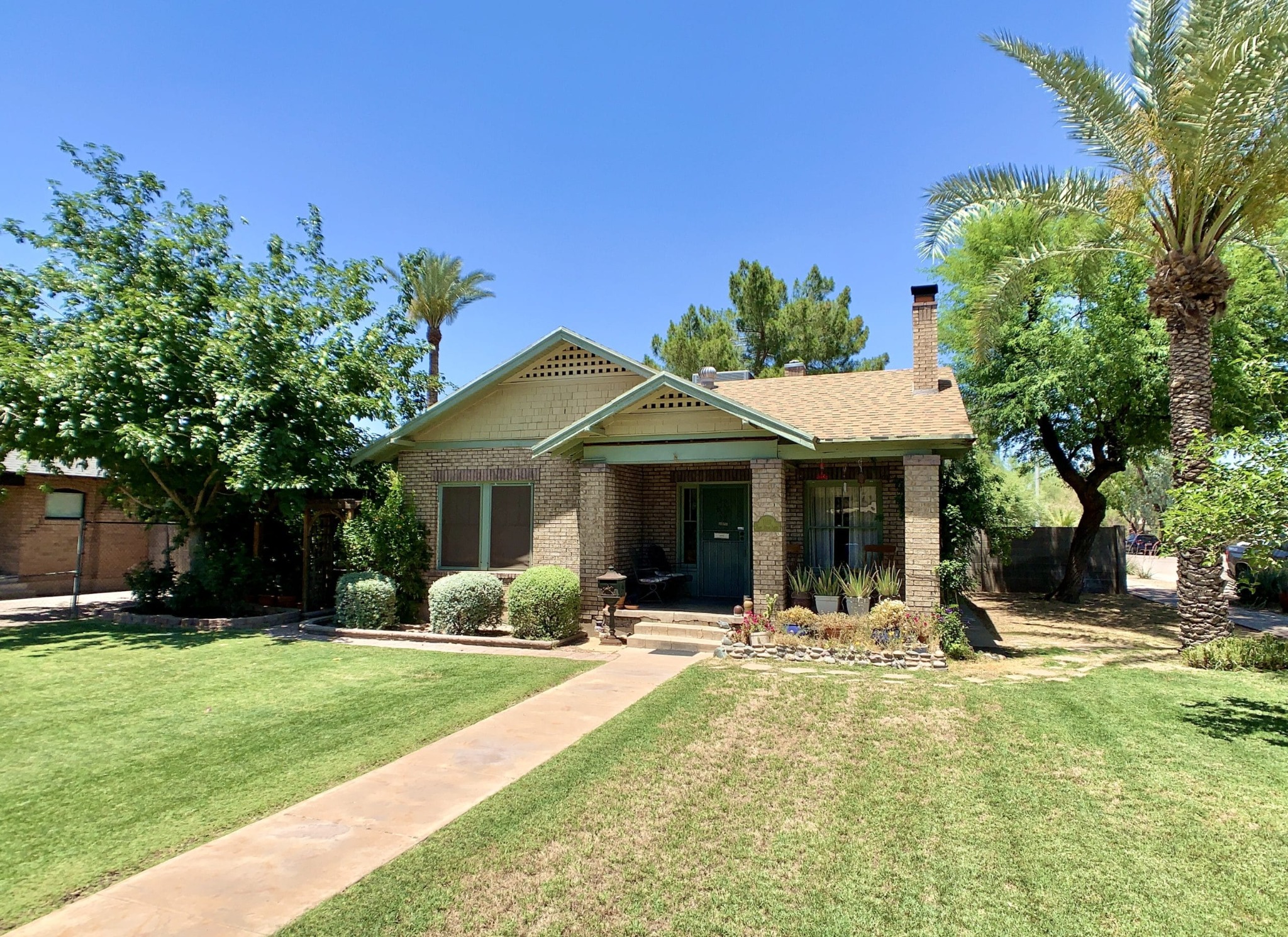 Coronado one story brick cottage with small front porch