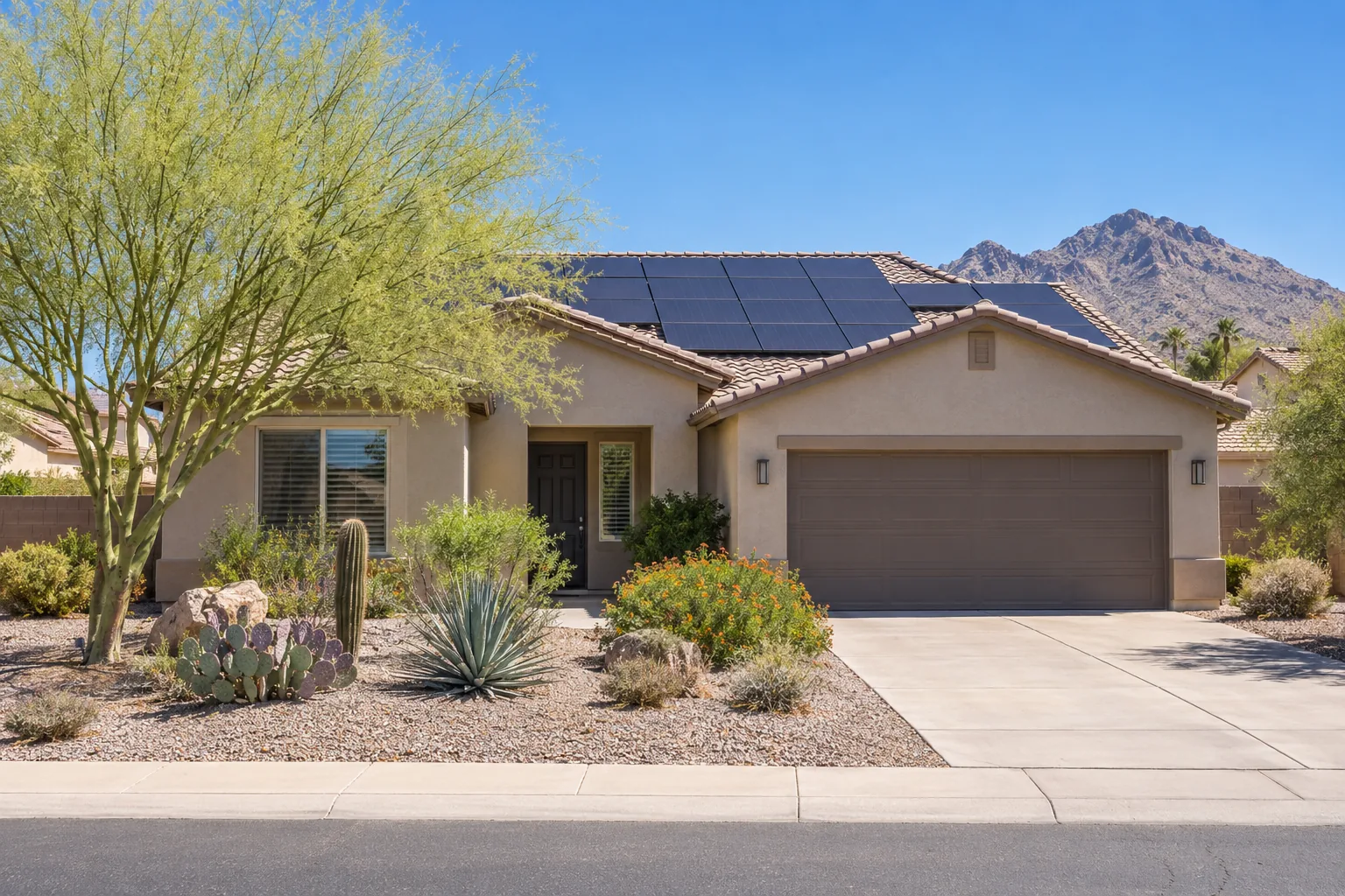 Phoenix home with solar panels in the summer sun